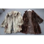 A mid-20th Century brown fur three-quarter length jacket, length approx 102cm, together with another