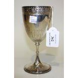 An Edwardian silver goblet, the half reeded ovoid bowl decorated with a band of flowerhead and