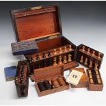 A late Victorian walnut games compendium case, the hinged lid and front revealing a Staunton chess