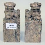 A pair of Chinese soapstone seals, early 20th Century, each carved with a Buddhistic lion and cub