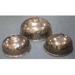 A pair of graduated plated oval meat domes with beaded handles and rims by William Hutton & Sons,