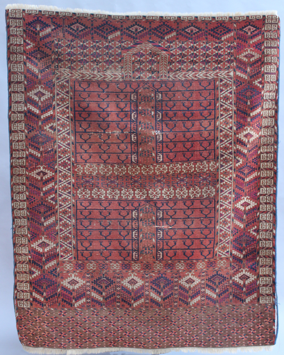 A Tekke Ensi, West Turkestan, circa 1900, the compartmentalized field with overall stylized