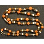 A banded agate cylindrical and spherical bead necklace, length approx 69cm.