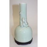 A Chinese celadon glazed vase, mark of Kangxi but probably late 19th Century, of mallet form, the