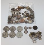 A collection of British and foreign coins, including a George III shilling 1817, a Victoria