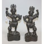 A pair of Chinese brown patinated bronze lokopalas, in the Tang style but 18th/19th Century, each