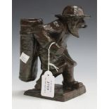 An early 20th Century brown and green patinated cast bronze figure of a standing bearded fisherman