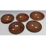 A group of five 18th Century wooden plates, diameter approx 18cm.
