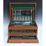 An Elizabeth II silver King's pattern canteen of cutlery, comprising twelve table knives and