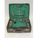 An Edwardian crocodile skin vanity case, detailed 'Drew & Sons Makers, Piccadilly Circus, W', the