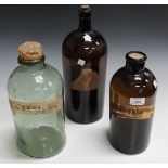 A group of three various glass drug jars, two with gilt naming labels.