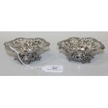 A pair of late Victorian silver bonbon dishes, each of circular form with pierced and embossed