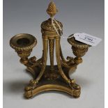 A mid-19th Century French cast ormolu twin branch desk candelabrum of Neoclassical design by