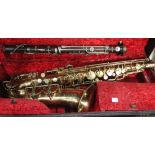 A plated soprano saxophone, marked 'Universel Savana Paris 33', a brass alto saxophone, marked '