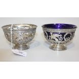 A pair of German silver pierced and embossed circular bowls, each decorated in the Empire style with