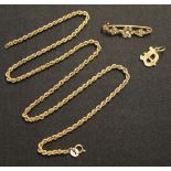 A gold and seed pearl set bar brooch with a floral motif, a 9ct gold initial 'D' pendant, and a