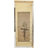 A Japanese hanging scroll painting, Meiji period, depicting a hawk tethered to a wooden t-bar, black