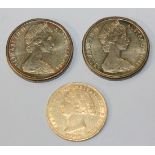 An Australia Sydney mint sovereign 1864 and two Australia one dollars 1984.