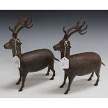 A pair of 19th Century Qajar damascened iron models of deer standing four square, each faintly