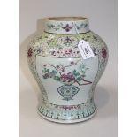 A Chinese famille rose porcelain jar, mid-19th Century, the baluster body painted with panels of