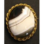 A Victorian gilt metal mounted banded agate oval brooch, width approx 4.5cm.
