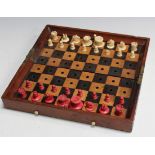 A late Victorian mahogany cased 'In Statu Quo' travelling chess set by Jaques & Son, London, the