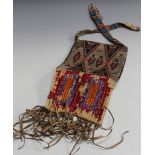 A late 19th/early 20th Century Native American beadwork leather bag, Northern Plains, the rawhide