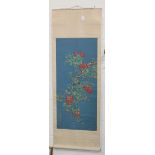 A Chinese scroll painting depicting a jay perched on a fruiting lychee branch against a blue ground,