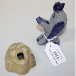 A stoneware bird whistle, probably German 19th Century, the grey body with blue glazed highlights,