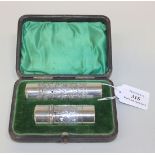 An Edwardian silver shaving set, comprising a cylinder shaving stick case and a cylindrical brush