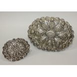 An early 20th Century Turkish .900 silver hanging mirror, with floral repoussé decoration within