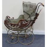 A 19th Century French wicker and wrought iron baby carriage with umbrella holder, height approx 86cm