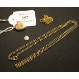 A gold curblink neckchain on a boltring clasp, another gold neckchain, a 9ct gold heart shaped