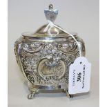 An Edwardian silver tea caddy, the hinged lid with rampant lion and shield finial, the tapering