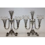 A pair of late Victorian plated epergne centrepieces, each with three wirework supports holding