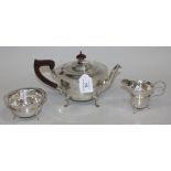 A George V silver three piece tea set, comprising teapot, milk jug and sugar bowl, each of