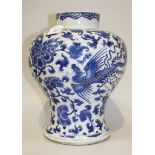 A Chinese blue and white porcelain vase, Kangxi period, of baluster form, painted with two long-