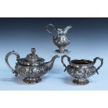 A William IV silver three piece tea set, comprising teapot, milk jug and two handled sugar bowl,