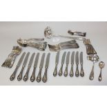 A Continental plated part canteen of cutlery decorated with scroll terminals, comprising six table