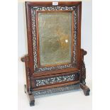 A Chinese hardwood table screen and stand, late 19th Century, the rectangular screen inset with a