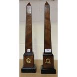 A pair of modern mahogany and ebonized mantel obelisks with applied wreath mounts, height approx