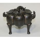 A Chinese brown patinated bronze censer and cover, Qing dynasty, modelled as a pumpkin, the cover