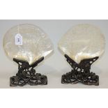 A pair of Chinese Canton export mother-of-pearl shells, late 19th Century, each finely carved in