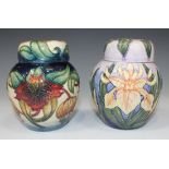 Two small Moorcroft Pottery ginger jars and covers, the first decorated in the Anna pattern designed