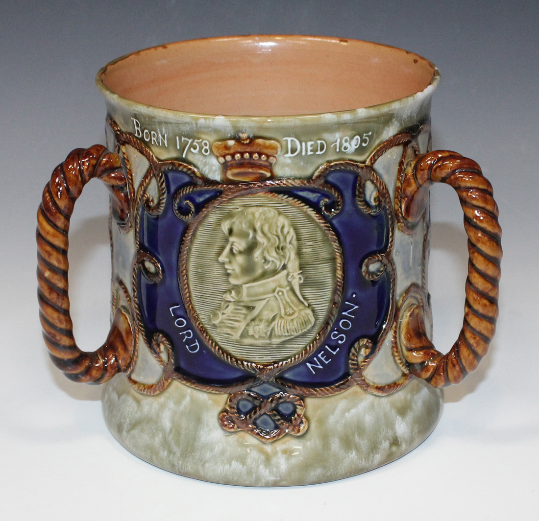 A Royal Doulton stoneware Lord Nelson commemorative tyg, circa 1905, the mottled green ground