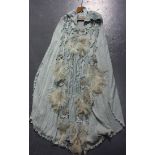 A Diana Leslie Animal Rainbow pale blue hooded cape with decorated back and appliqué feather
