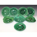 Eight green glazed leaf and flower moulded assorted plates and dishes, 19th Century, including two