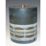 A Newlyn Troika pottery lampbase, 1970-83, of cylindrical form, the dark blue washed matt textured