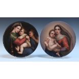 A pair of KPM Berlin porcelain circular plaques, late 19th Century, both painted after Raphael by