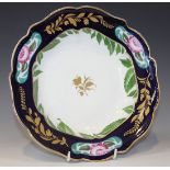 A Leningrad St. Petersburg porcelain soup plate, circa 1919, gilt with a central floral sprig, the